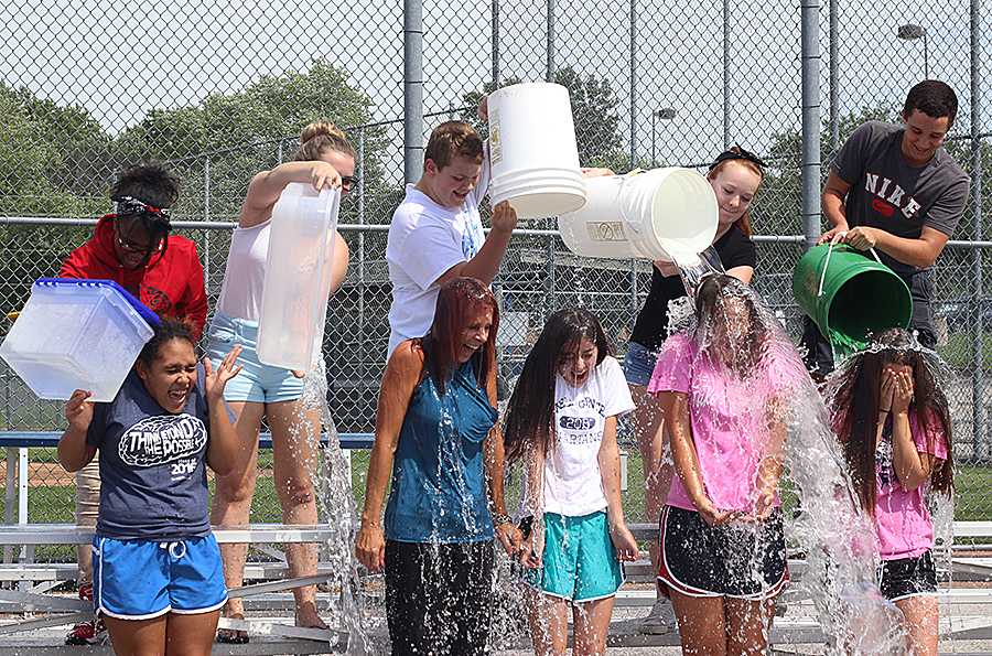 Mrs. Vicki Pohlman and the student council officers take the Ice Bucket Challenge after school on August 22nd. They donated $1,000 on behalf of Student Council