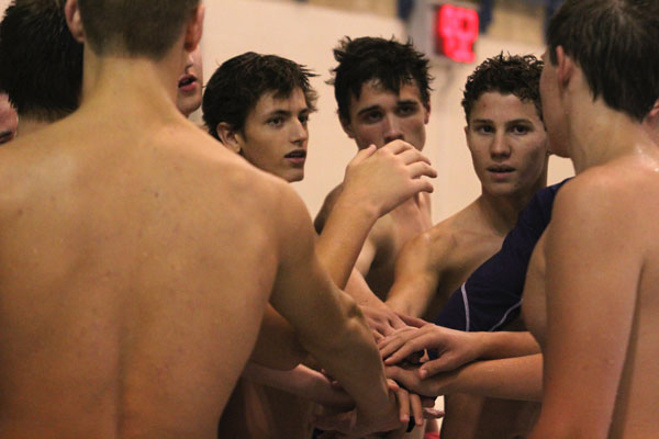 The team cheers after their meet concludes on Sept. 17.