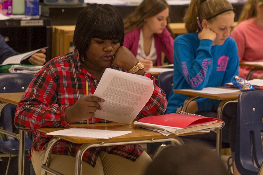 Junior Adrianne Jeffries reads through an article in Ms. Kim Okais English III class on Wednesday. Jeffries enrolled at FHC shortly before fall break after being enrolled at Normandy High School.