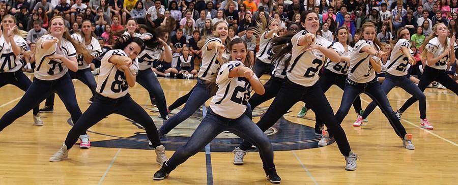 The Sensations dance their hearts out performing in front of the school.