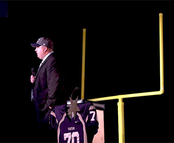 Coach Pete Eberhardt addresses the crowd at the meeting on April 7. This was the first time that Eberhardt met the Spartan community.