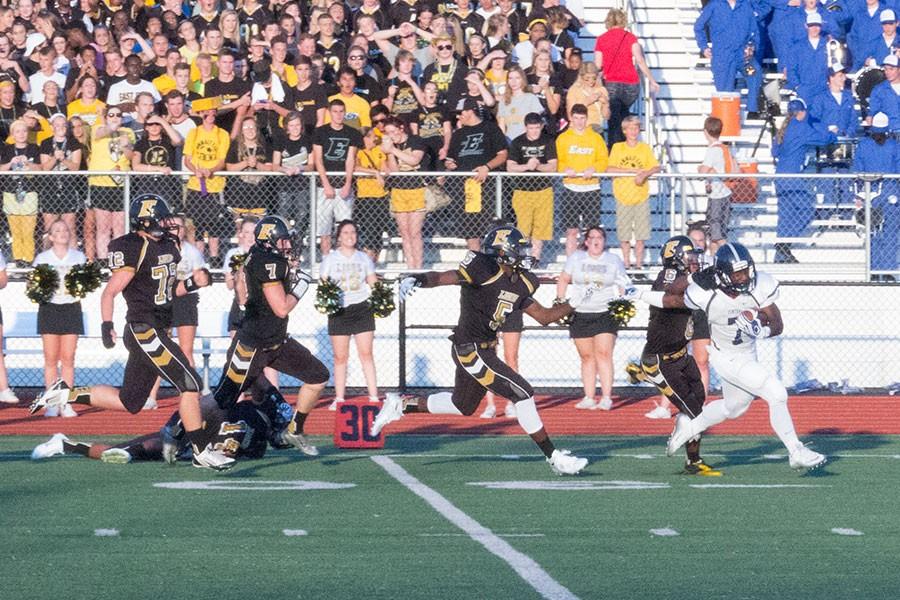 Senior running back Jordon Cooper pulls away from a Fort Zumwalt East defender during his 80-yard touchdown run in the third quarter of the Spartans season opener. The team lost Coach Pete Eberhardt's first game as coach 43-20.