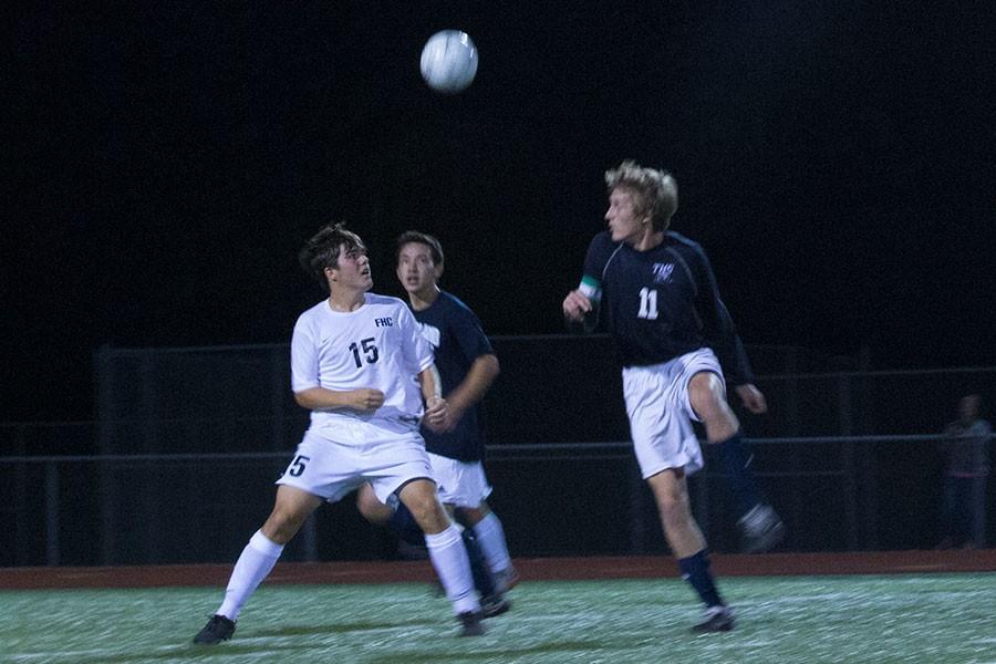 Sophomore Joey Mueller prepares to leap in the air to head the ball against Timberland. The Spartans dominated the game, winning 4-1. 