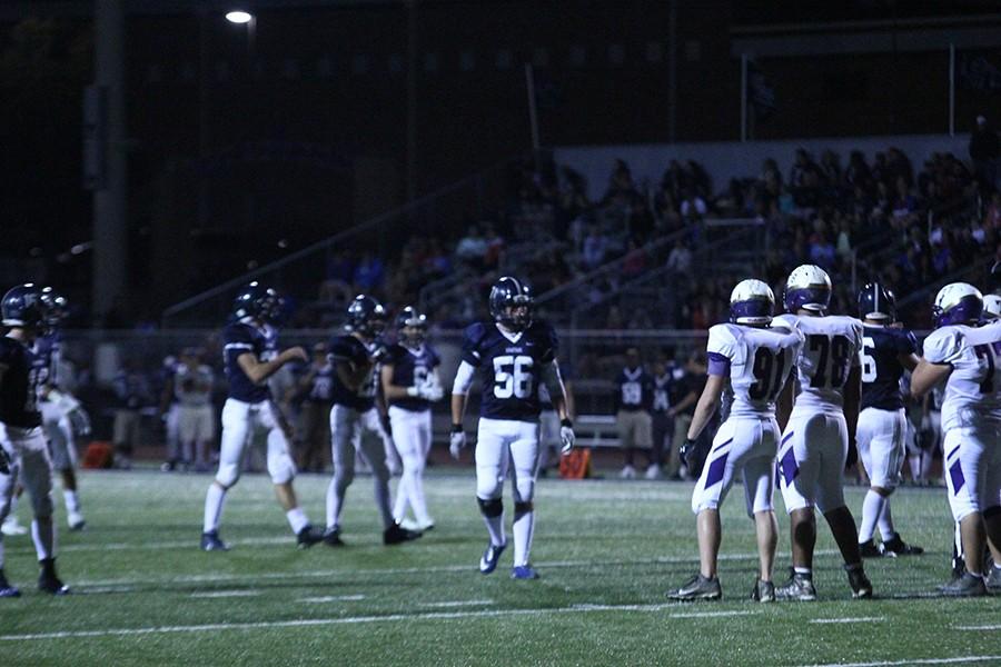 Sophomore Sybree Itayem, 56, crosses the field as Spartans prepare to line up