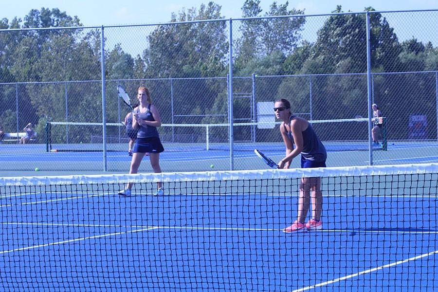 Senior Abby Conoyer and Junior Maddie Gunnell square off in a doubles match.