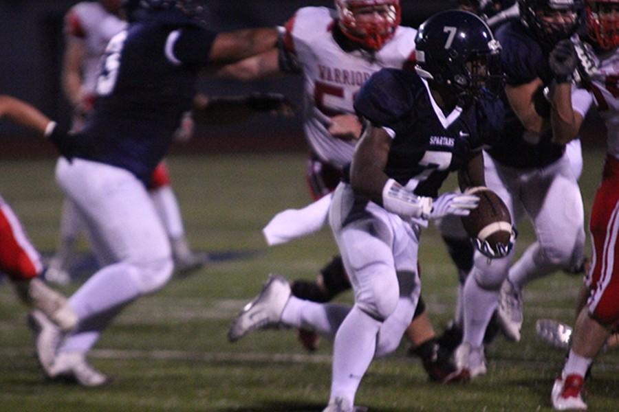 Senior running-back Jordon Cooper makes a run up the field earlier this season.