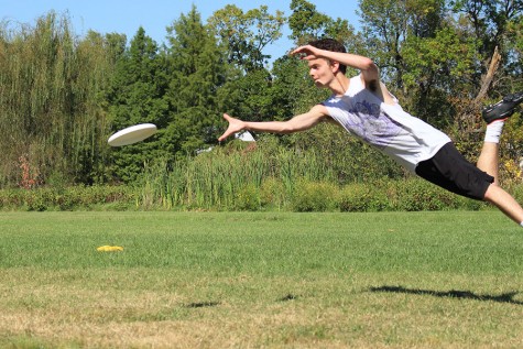 At the fall pick ups during a drill, junior Jake Hayden flies for a disc.  He caught the disc and won a point for his team in the drill.  This happened at Lions Park when ultimate frisbee had fall pickups.
