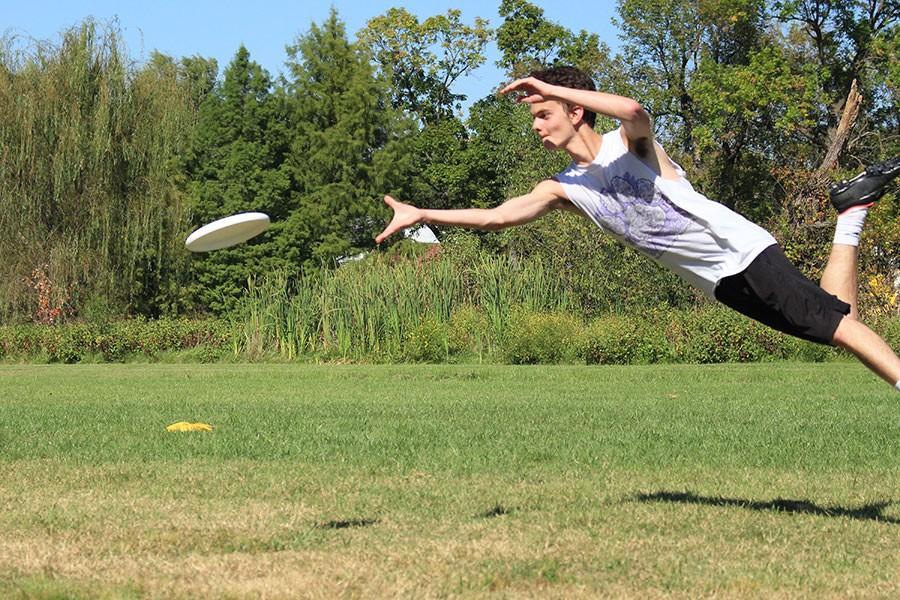 At the fall pick ups during a drill, junior Jake Hayden flies for a disc.  He caught the disc and won a point for his team in the drill.  This happened at Lions Park when ultimate frisbee had fall pickups.
