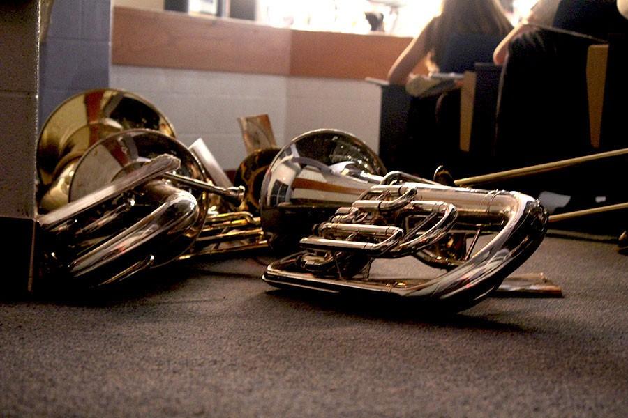 Band members instruments lie on the floor on Wednesday, Dec. 9 before the performances of the wind ensemble, concert band and symphonic band. 