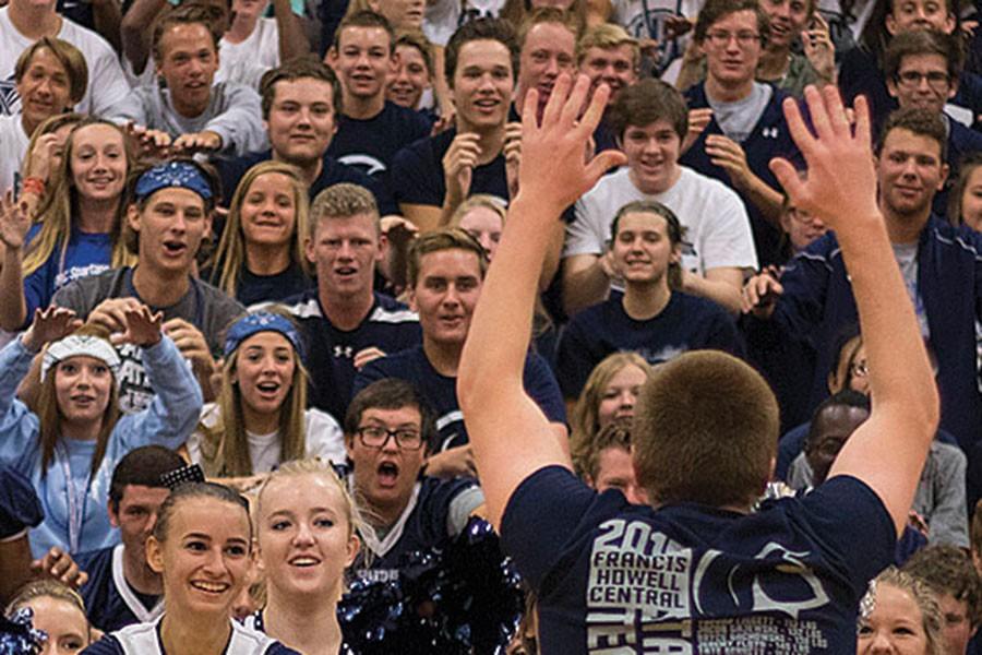 Members+of+the+crowd+at+the+pep+assembly+stare+intently+at+junior+Trent+Diener+as+he+leads+the+crowd+in+the+roller+coaster+chant+at+a+pep+assembly+in+August.+Diener+is+one+of+the+leaders+of+the+school+Pep+Club+and+helps+organize+the+%40FHCGetRowdy+Twitter+account.