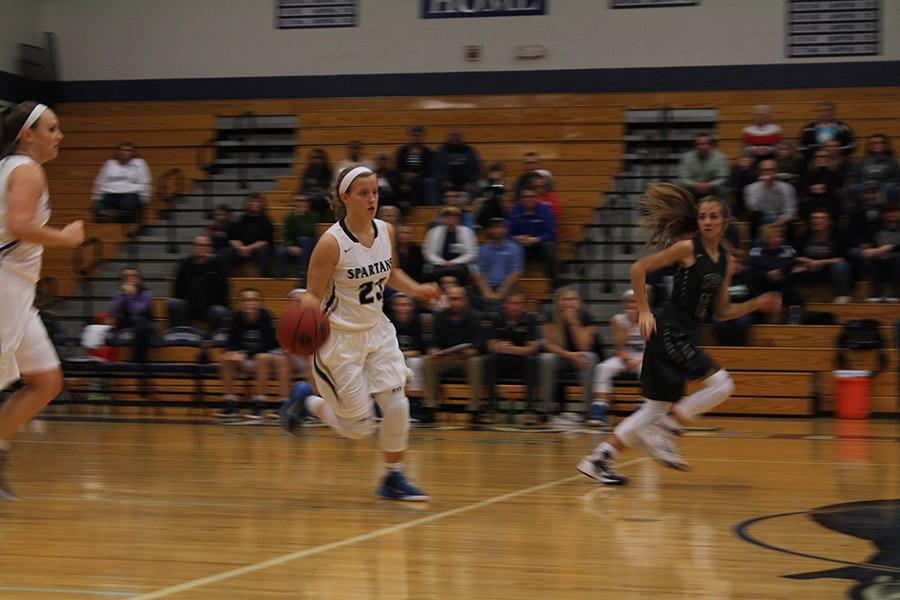 Riley Wilson dribbles the ball down the court to score a point for Francis Howell Central.