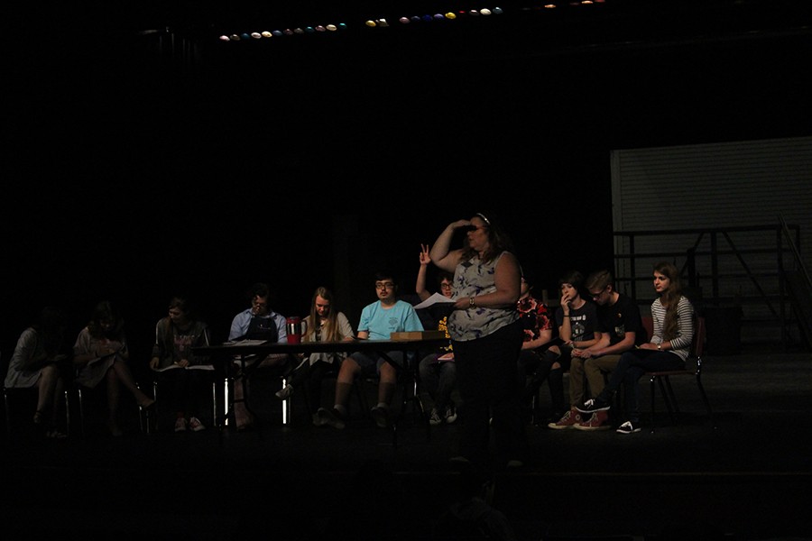 Mrs. Nelson and the cast do a script read through. 