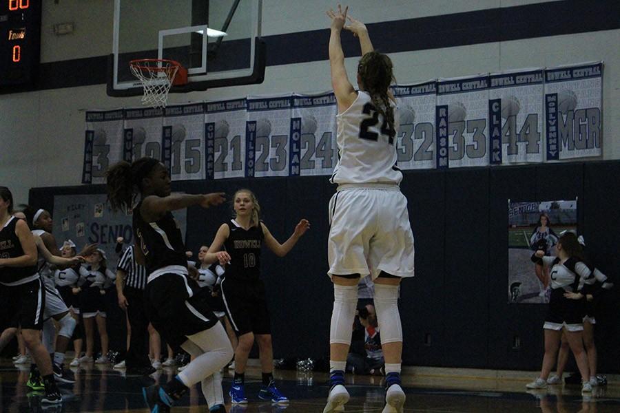 Senior Kaitlin Nolan shoots the basketball to score a basket for the Lady Spartans