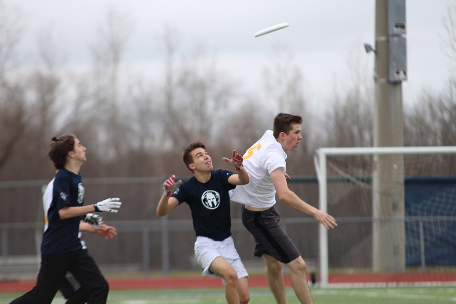 Senior Eric Gibbs prepares to catch the frisbee. 