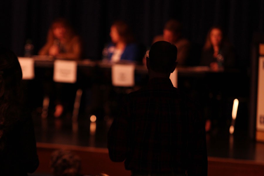 One of the 75 community members in attendance asks the four Board of Education candidates a question. The candidates gathered as part of FHC Publications candidate forum a week ahead of the April 5 election, where two of the candidates will earn spots on the board.