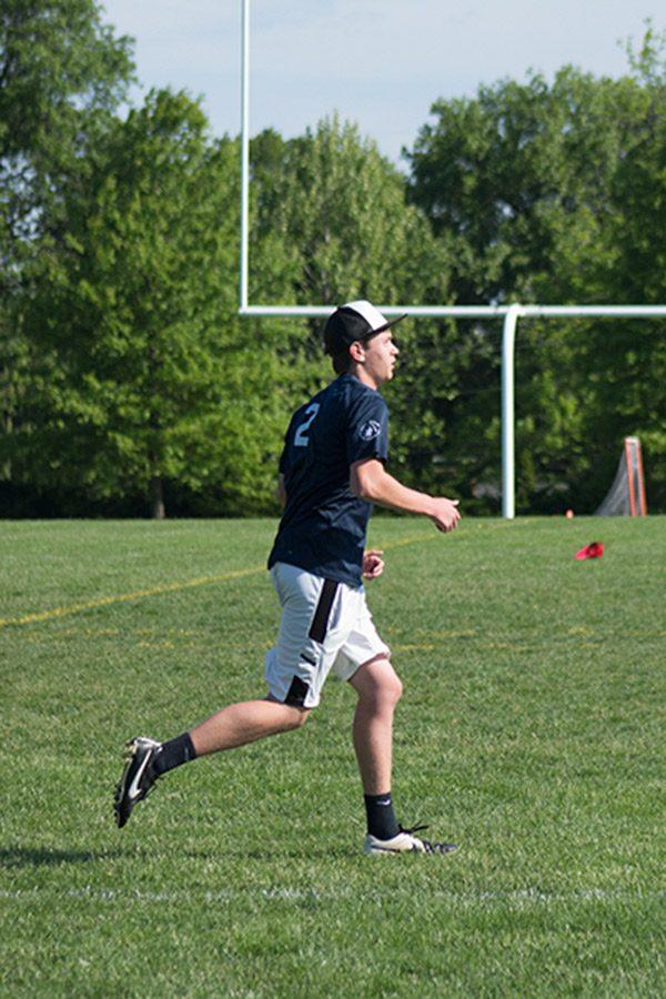 Tj Buchanan waits for a teammate to pass him the frisbee during state tournament. 