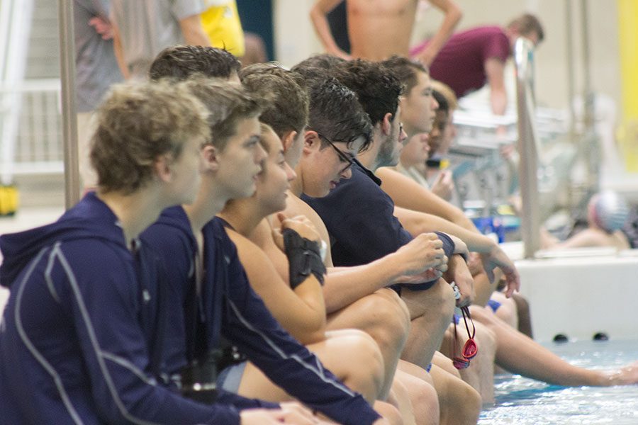 Spartan swimmers, including Colin Williams, wait for their event at the swim meet. State is in the near future for them.