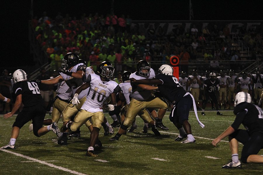 In this photo, the team is trying to defeat FHN with the crowd behind them  cheering for them.