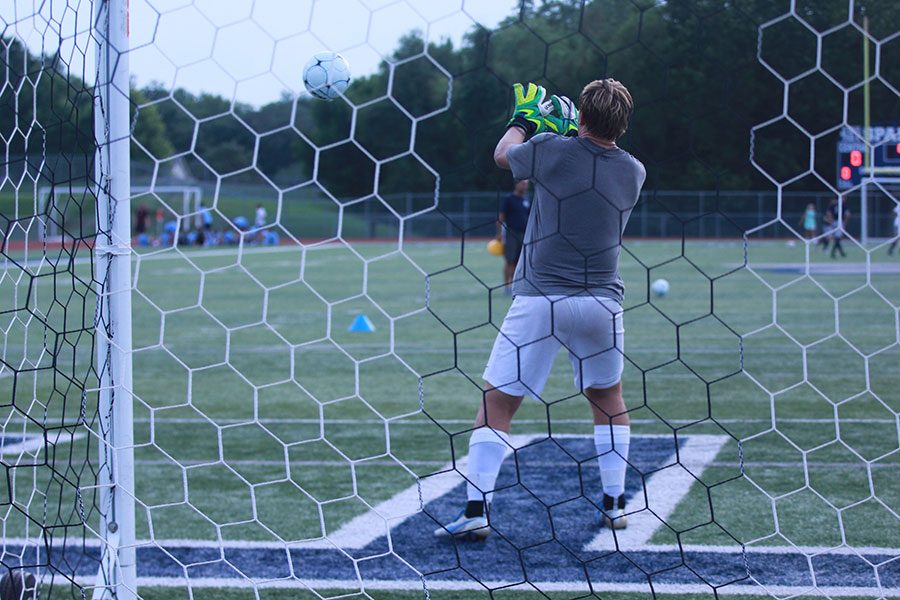 Goalie+Nathan+Smith+warms+up+before+a+game.+The+soccer+team+are+8-9.