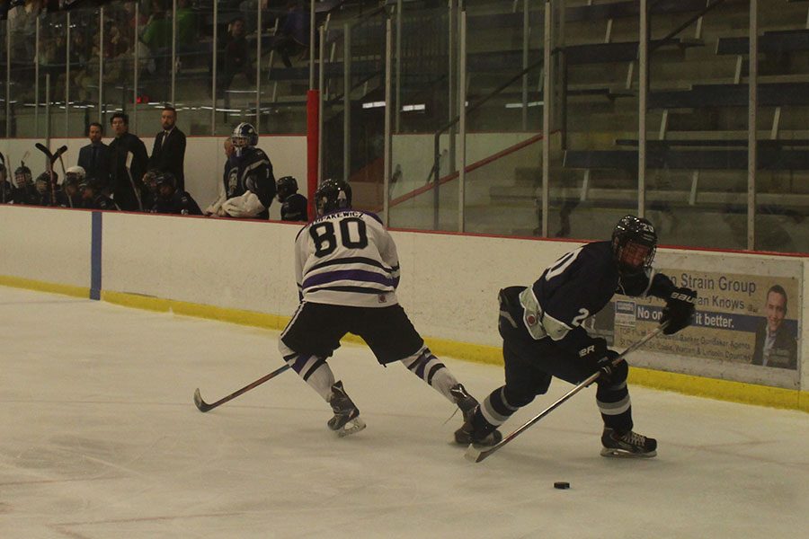 Bradley Anderson fighting for the puck. FZE was an aggressive team.