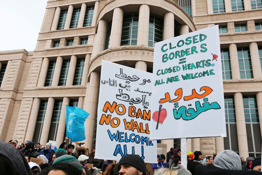 Protesters on 10th street holding signs on Feb. 4th to contradict the ban on refugees. 