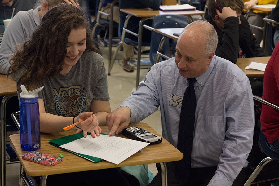 Mr.+Koz+discusses+with+a+student+the+best+way+to+go+about+one+of+many+complicated+problems.+Pre-AP+Chem+is+one+of+the+most+intensive+honors+classes+offered+at+FHC.