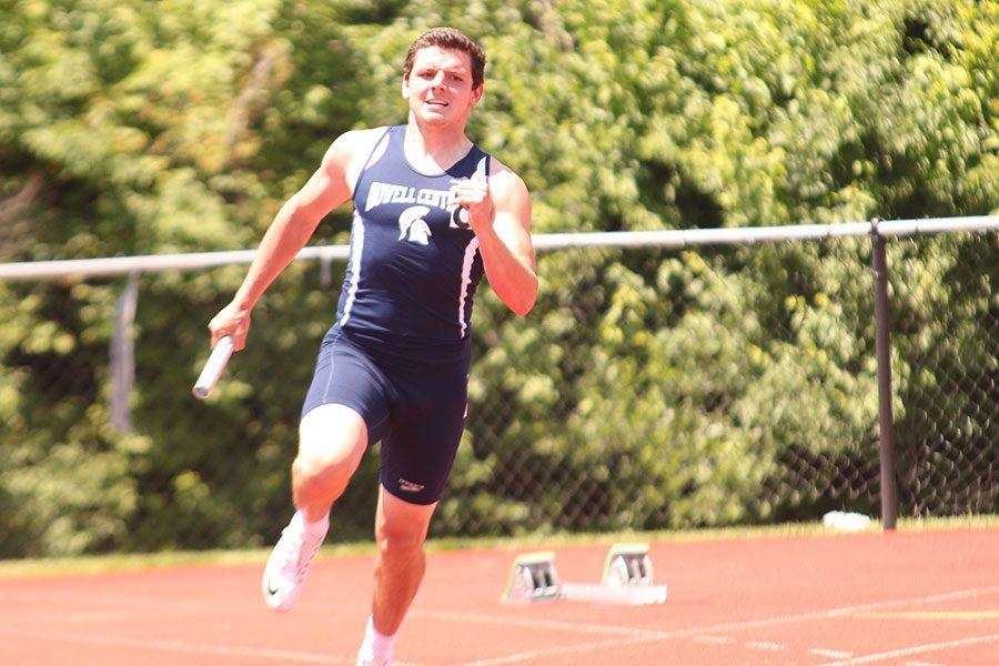 Micah Skebo sprints in a relay at sectionals last year. Skebo predicts the team is going to win GACs this year.