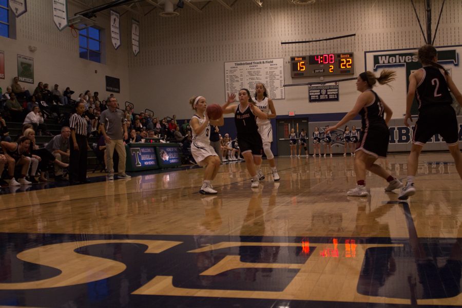 Senior Mackinsey Hamer prepares to make a shot. The team had a close loss at 53-48.