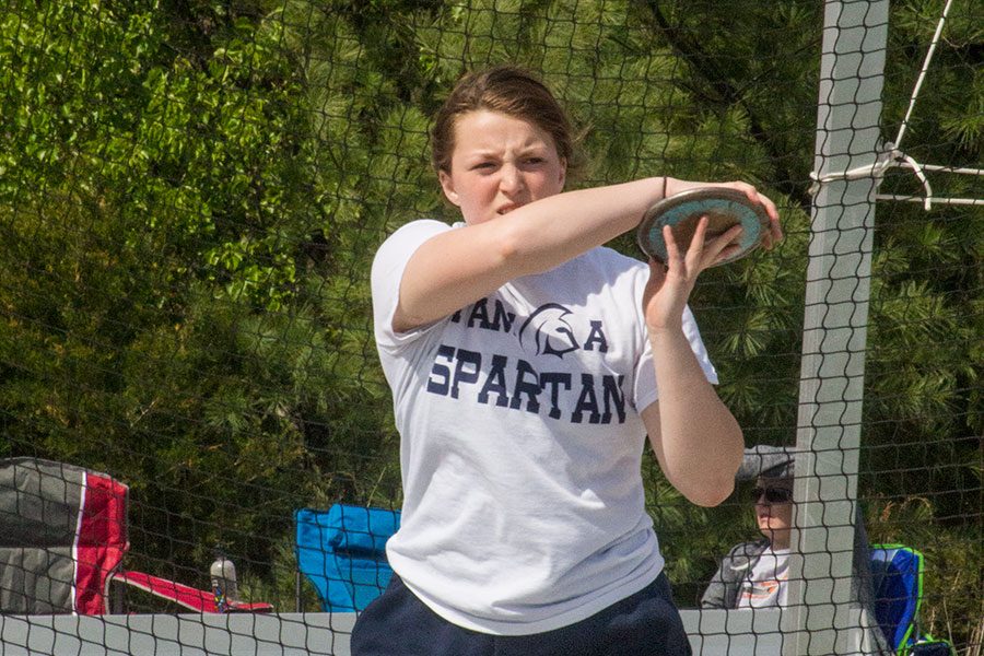 Junior Olivia Green practices throwing discus. She hopes to qualify for state.