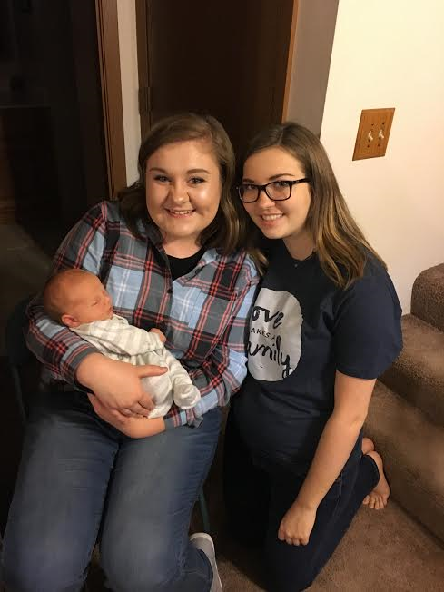 Amy Cato poses with best friend Daria Colvin as she holds baby Jude. For Cato, Colvin has been a one of her greatest supporters during her transition returning to high school