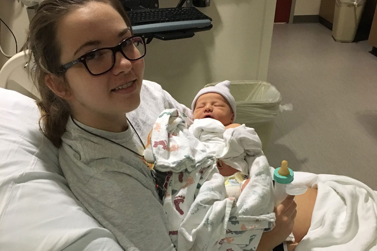 A little over 24 hours after giving birth, Cato holds Jude for the first time.  As she fed him a bottle, all of the troubles of Catos pregnancies faded away.