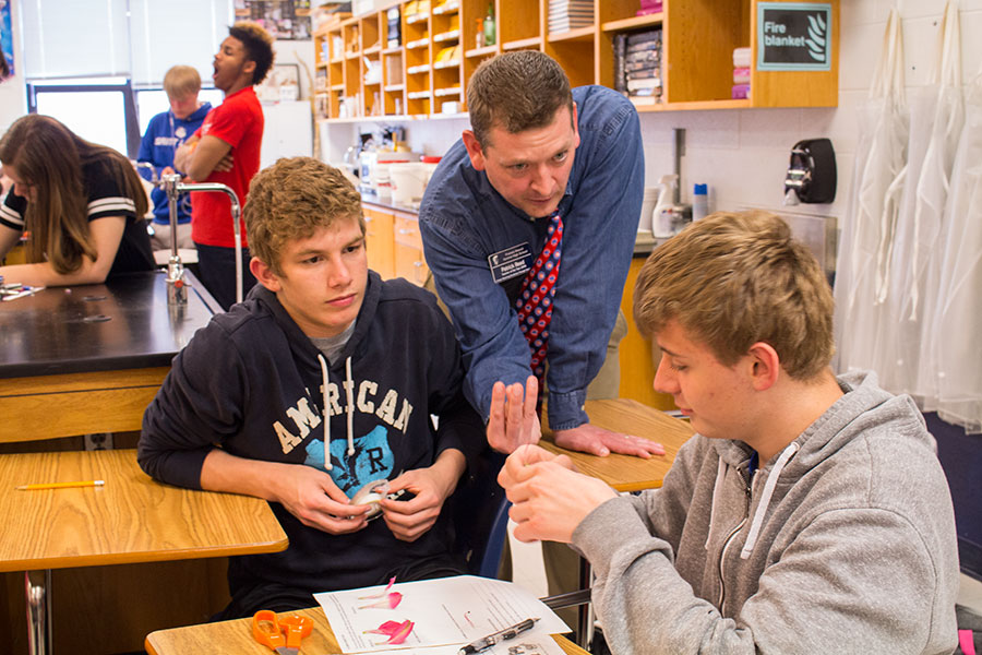 Mr. reed helps students understand a concept in class. Mr. Reed has inspired many students. 