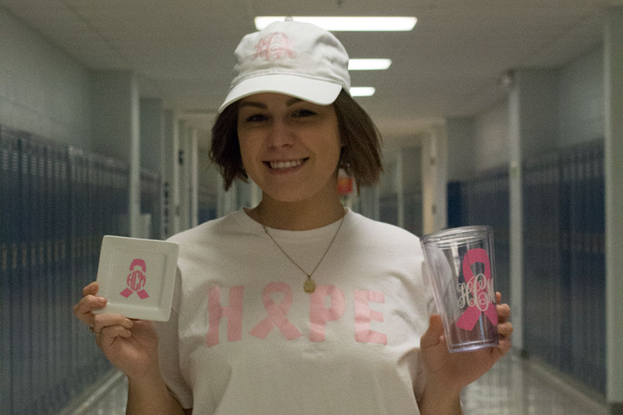 Hannah Cooper holding some of the merchandise that was sold. 