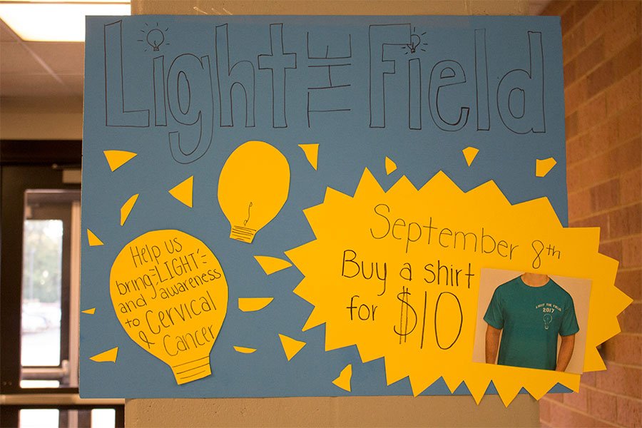 Student council hangs posters in hallways around school advertising Light the Field. Student Council has held this event for two years. 