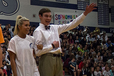 Seniors Will James and Macey Leap stand and wave at Homecoming pep assembly