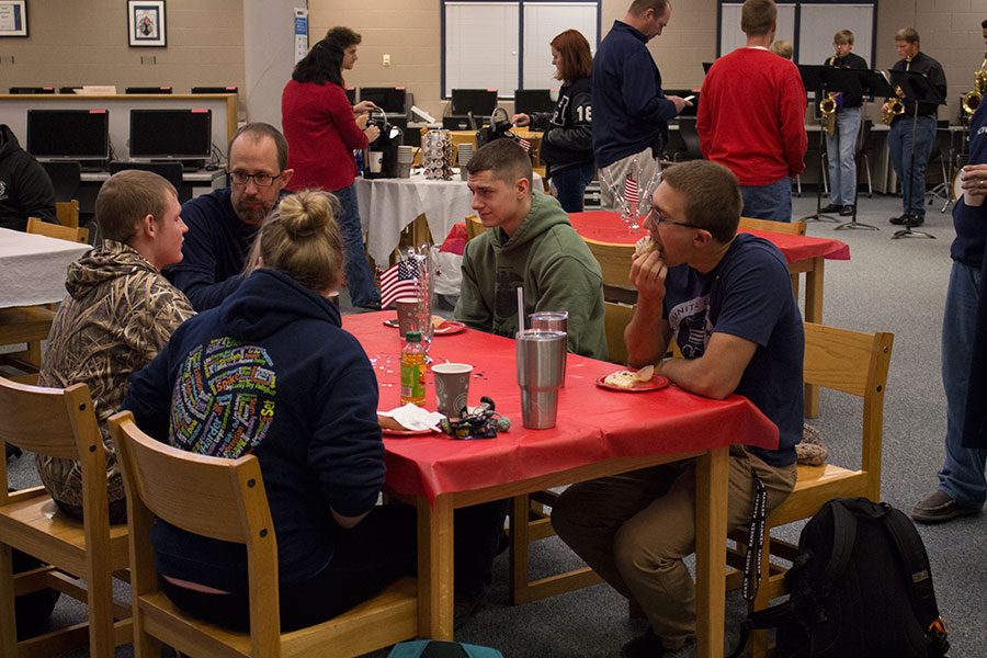 Veterans and students enjoy the veterans breakfast planned by Epsilon Beta. The veterans had come together and celebrated Veteranss Day with their families.