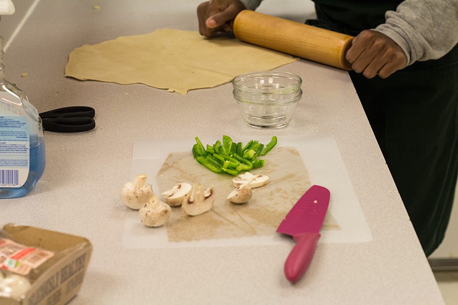 Within the FACs department students participate in many activities. Here, a student is cooking a meal.