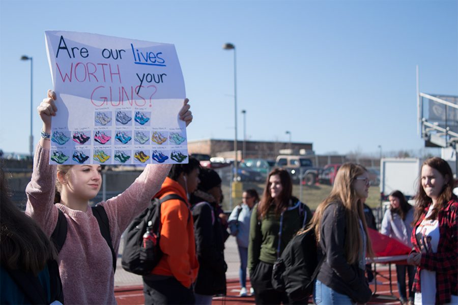 A+student+holds+a+handmade+sign+during+the+walkout.+Many+did+this+to+show+their+support+of+the+cause.+