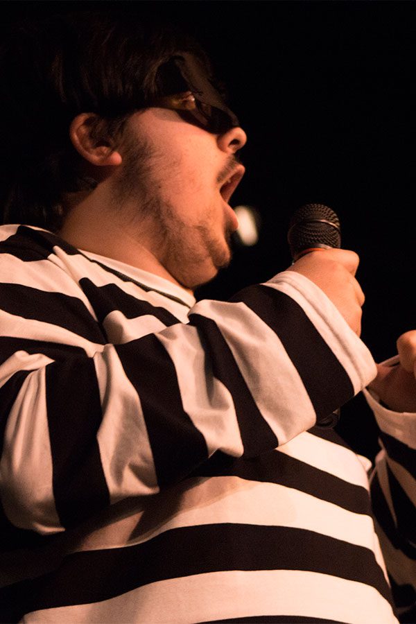 Seth Ferrel performs at the improv show. As well as acting, Ferrell lends his soprano singing voice to his barbershop quartet. 
