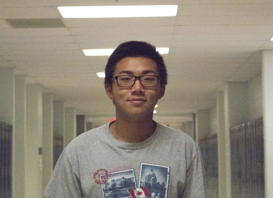 Swimmer Michael Yu poses for a headshot after giving an interview on whats new with Boys Swim.