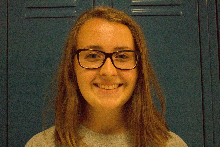 Lauren Marino smiles in front of lockers. Marino was a part of the Student Council committee to help organize Light the Field. 