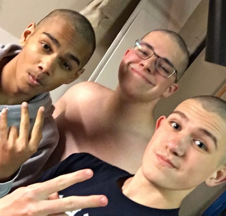 This photo was taken the night when the swim team members shaved their head. The "after" photo is shown here.