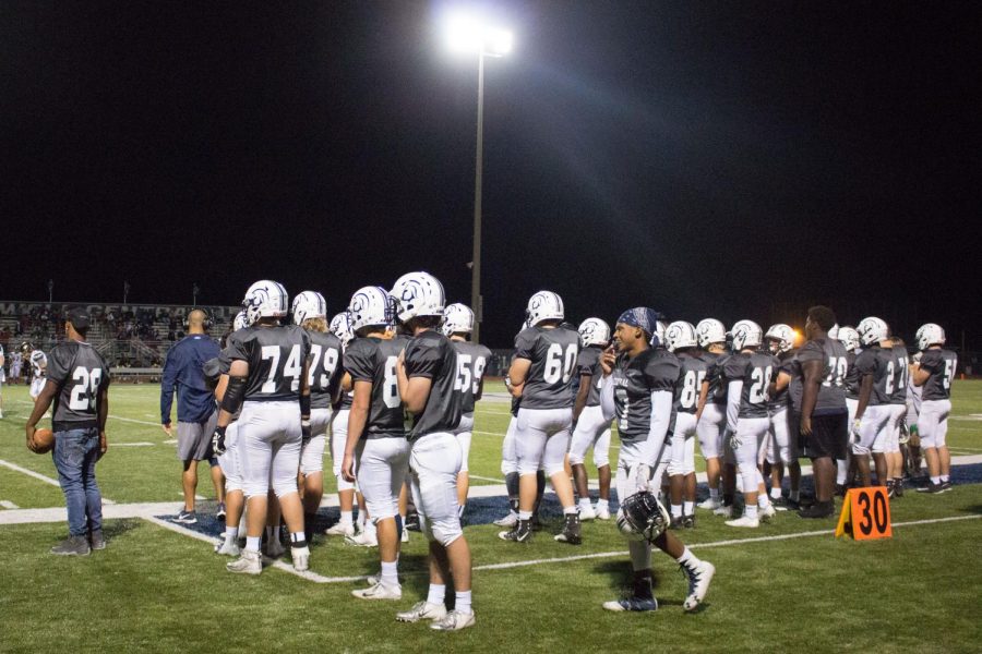 The football team watches from the sidelines during its victory over Francis Howell North on Sept. 28. The win snapped a five-game losing streak for the team. 