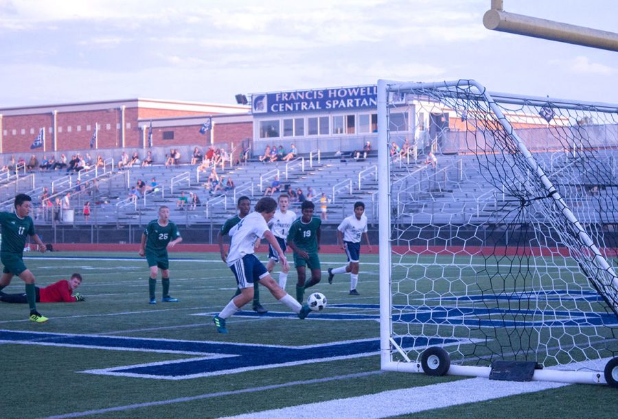 FHC player leaves behind goalkeeper at the top of the box to score goal. 