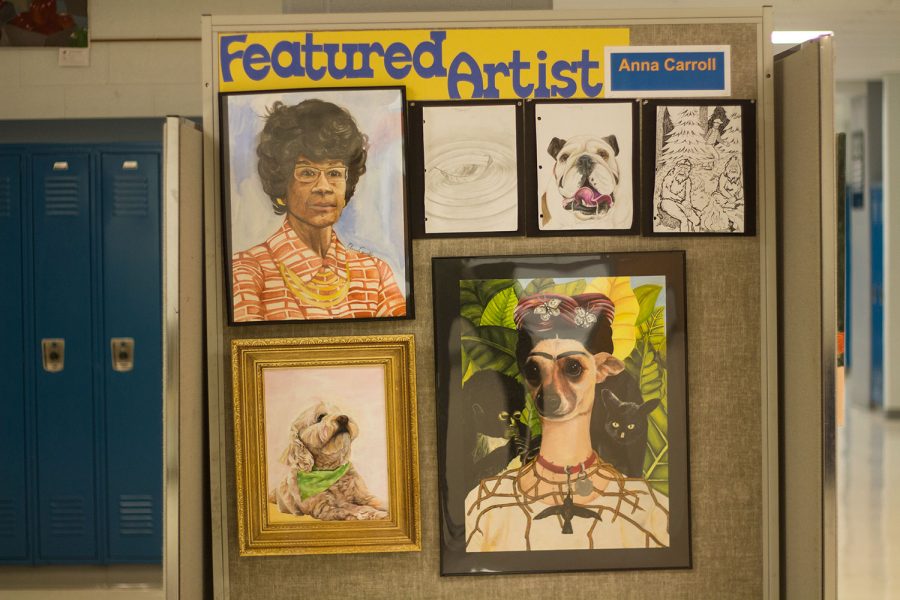 Junior Anna Carroll's work on display in the art hallway. Carroll and Ms. Switzer picked out which pieces to be on display.