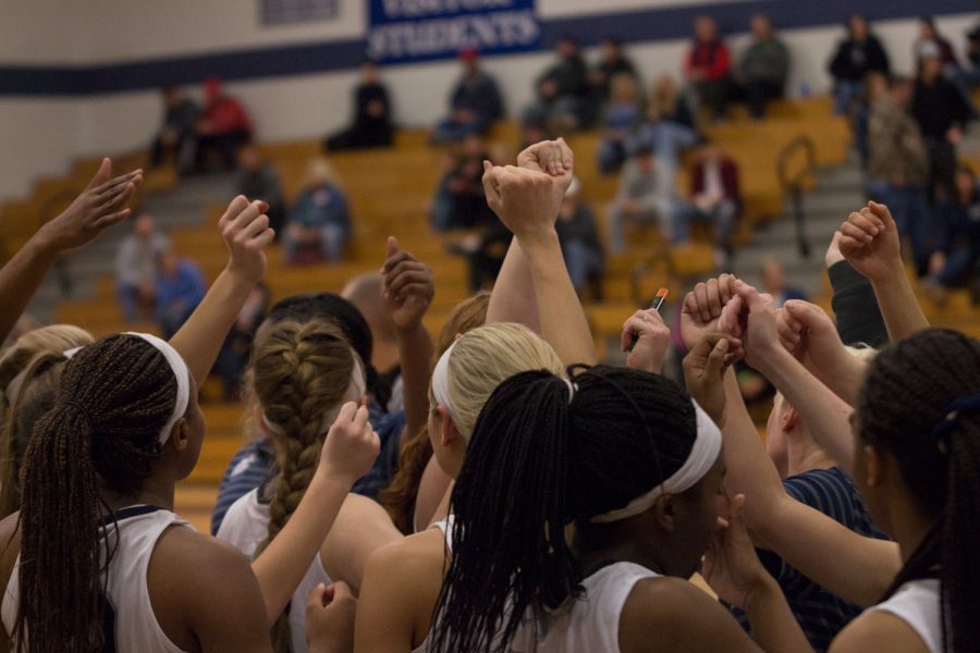 The Spartan girls huddle before their game; in which they won 48-14.
