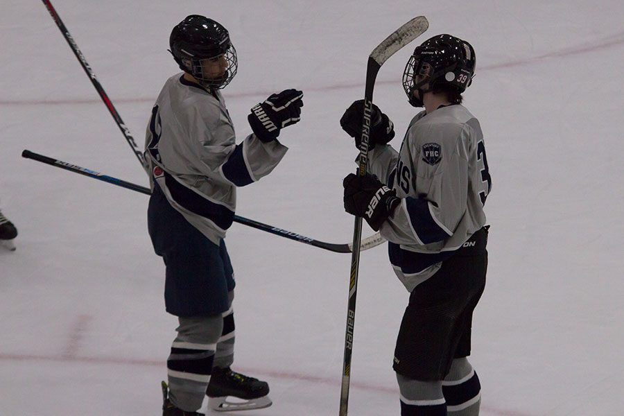 Forwards junior Tyler Bradley and sophomore Deacon Schmatt exchange a fist bump during their match against Timberland. Bradley is ranked 17th in Goals for the St.Louis area.
