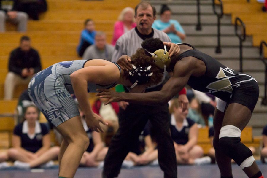 Senior Austin Smith prepares himself to take down his opponent. His goal for the season; make it to the state level. 