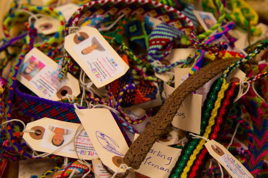 Spanish Honor Society bracelets, made by impoverished people in Nicaragua and Guatemala, sit, waiting to be sold by members. The club only started this year and is already finding ways to help spread happiness outside of the school. 