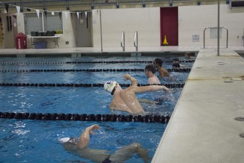 The boys swim a specific amount of laps and yardage every practice together as a team.